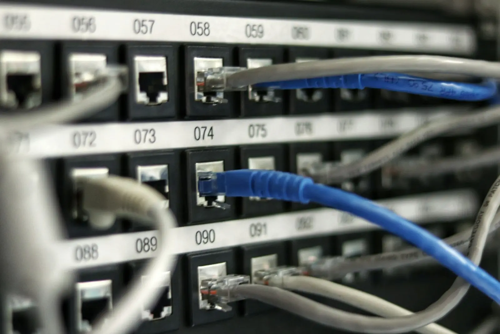 Network cabling patched into a data centre rack